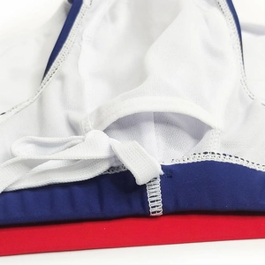 Detail of men swimwear lining with white mesh interior, elastic fabric and drawcord