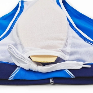 Detail of blue swim trunks featuring white mesh lining and removable sponge padding