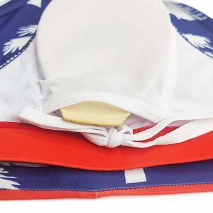 Detail view of men's swim briefs featuring removable pads and coconut palm print