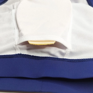 Detail view of breathable white mesh lining and removable padding pocket in men's swimwear