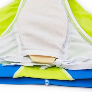 Detailed view of men's swim briefs with white mesh lining, protective cup, and drawstring