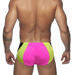 Rear view of quick-dry men's swim trunks with pink, yellow and black color-block panels