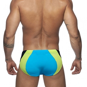 Rear view of men's quick-dry swim briefs featuring sky blue and neon green patchwork