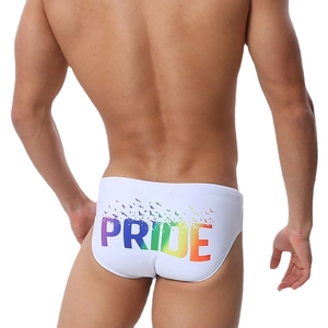 Men's white swim briefs featuring a rainbow Pride print and bird silhouette on the back