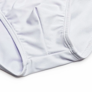 Macro shot of white high-elastic swim briefs showing premium fabric and double-stitch seams