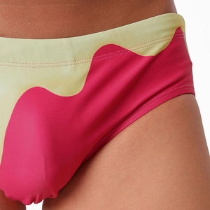 Detailed macro view of the smooth gradient wave pattern on men's elastic swim briefs