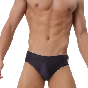 Detail view of men's printed swim briefs showing quick-dry fabric and athletic fit