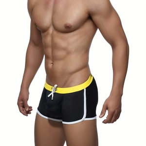 Men's boxer swim trunks in black and yellow contrast with drawstring waist and white trim