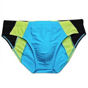 Detailed flat lay of men's quick-dry swim briefs in bright blue with neon green contrast