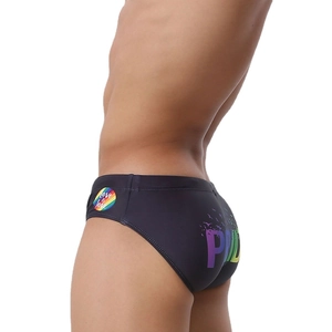 Detail view of black men's swim briefs featuring Pride rainbow graphics and Love is love logo