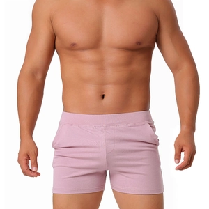 Men's slim fit cotton lounge shorts in soft pink with elastic waistband and pockets