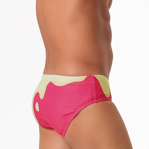 Detail view of colorful gradient swim briefs with ergonomic fit and quick-dry fabric