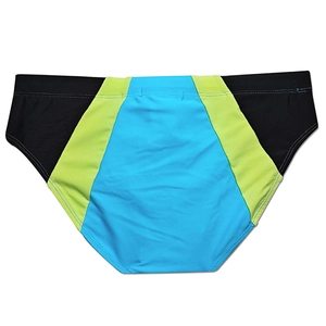 Flat lay of men's quick-dry swim briefs featuring black, yellow, and blue patchwork panels