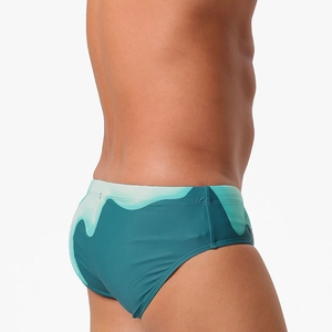Men's gradient blue-green wave print swim briefs with low-rise athletic cut and quick-dry fabric