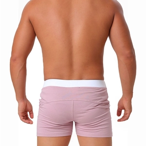 Detailed back view of men's dusty pink boxer briefs with white elastic waistband
