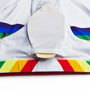 Macro detail of men's quick-dry swimwear featuring rainbow waistband and protective cup pocket