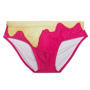 Detail of pink men's swim briefs featuring yellow gradient melting graphics on smooth fabric