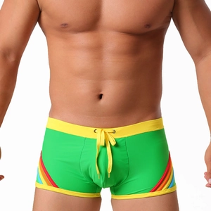Green men's swim trunks with vibrant rainbow stripes and yellow drawstring waistband