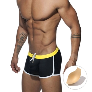 Men's color block swimming trunks in black and yellow with inner contour pad