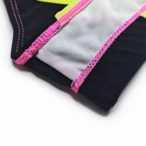 Detail view of quick-dry swim briefs showing macaron color stitching and mesh lining