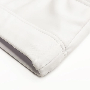 Macro shot of fine stitching and edge binding on men's quick-dry elastic swimwear fabric