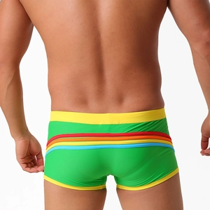 Macro rear view showing green men's swim trunks with vibrant rainbow stripes and yellow trim