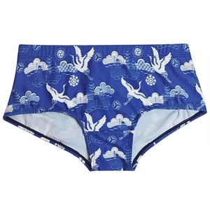Men's navy swim trunks with traditional crane and cloud print in a flat layout view