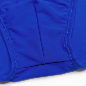 Macro shot of royal blue quick-dry fabric and reinforced double-needle stitching detail