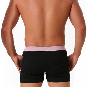 Rear view of men's cotton boxer briefs in black with a pink elastic waistband