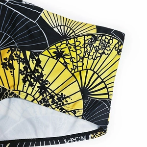 Macro shot of Japanese fan and wave print detail on quick-dry men's swim trunks