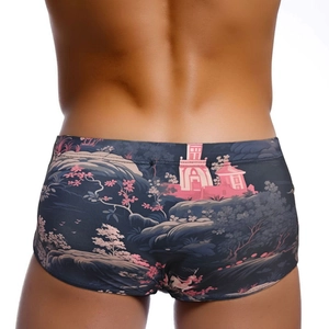 Men's low-waist swim trunks with deep blue Japanese landscape print and snug fit