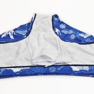 Detail of men's swim trunks featuring oriental wave patterns, mesh lining and drawstring