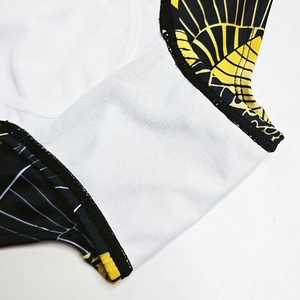 Detailed close-up of quick-dry swim trunks showing elastic lining and geometric print