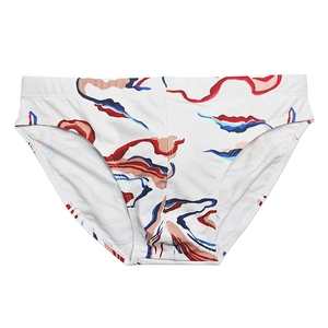 Detail of men's white swim briefs featuring dynamic red and blue wave pattern print