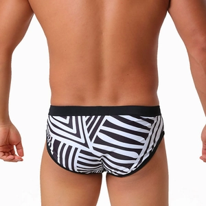 Men's sexy black and white geometric stripe swim briefs shown from the back view