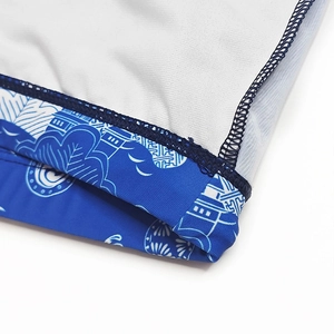 Macro shot of men's swim shorts featuring Chinese crane print and high-density stitching