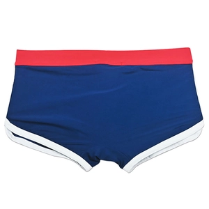Detail view of mens swim trunks with blue fabric, red waistband and white trim