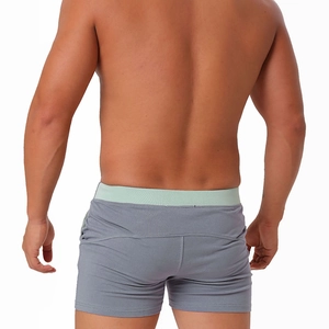Rear view of men's grey cotton boxer shorts with green contrast waistband details
