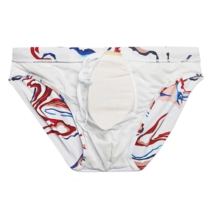 Close-up of men's white swim briefs with colorful marble print and adjustable drawstrings