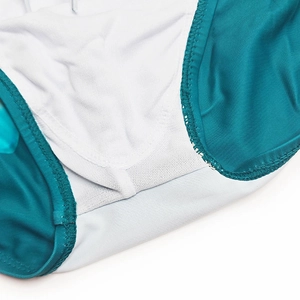 Close-up of breathable white mesh lining and reinforced stitching on men's swim trunks