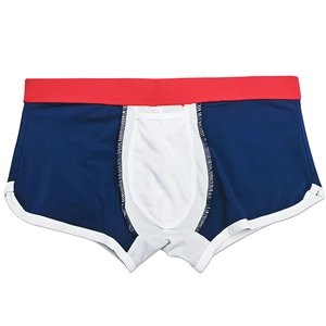 Detailed view of men's swimming trunks featuring contrast colors and ergonomic pouch