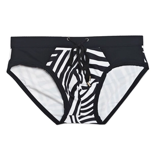 Detail of men's low-waisted swim briefs with black drawstring and zebra print pattern