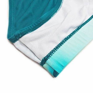 Close-up of flatlock stitching and mint green gradient edging on men's swim briefs