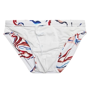 Detail of men's quick-dry swim briefs featuring abstract wave prints and adjustable drawstring