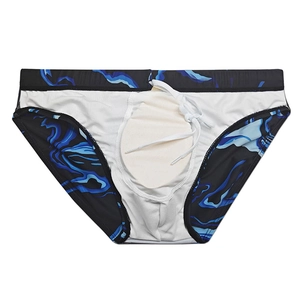 Close-up of men's swim briefs showing marble pattern, waist drawstring and internal padding