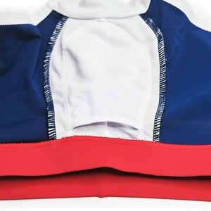 Detailed macro view of men's swim trunks featuring breathable white mesh lining and color stitching