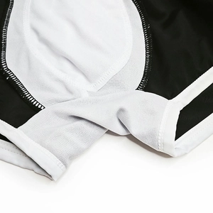 Detailed macro view of men's swim trunks with breathable white mesh lining and neat stitching