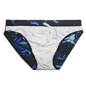 Detail view of men's swim briefs with marble print, elastic waistband, and white drawstring
