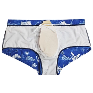 Detail of men's swim trunks with crane prints, showing internal cup pad and drawstring
