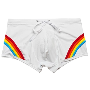 Detailed view of men's white swim trunks featuring rainbow side stripes and drawstring
